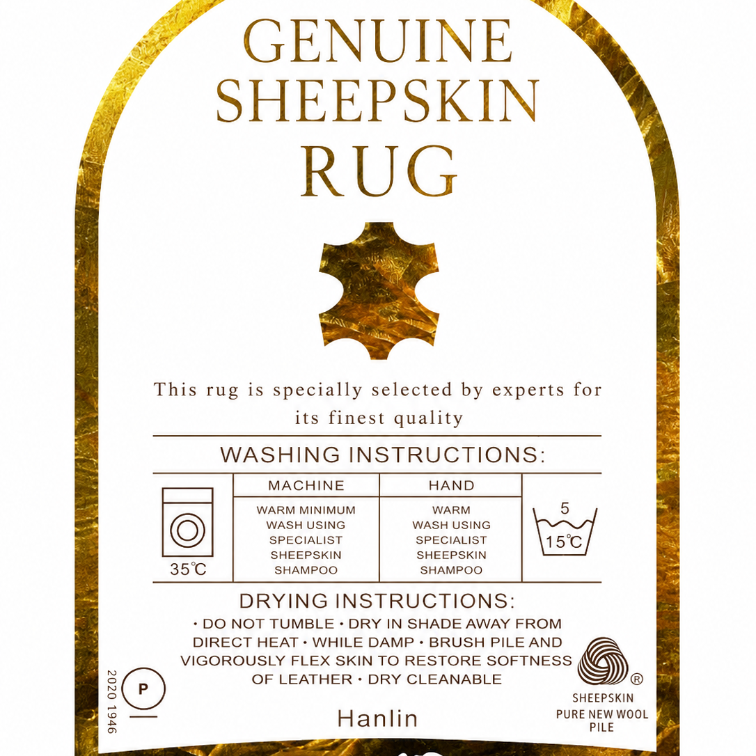 A square product label for a Genuine Sheepskin Rug by Hanlin, featuring a white center with gold text and washing/drying instructions, framed by a textured gold sheepskin border.