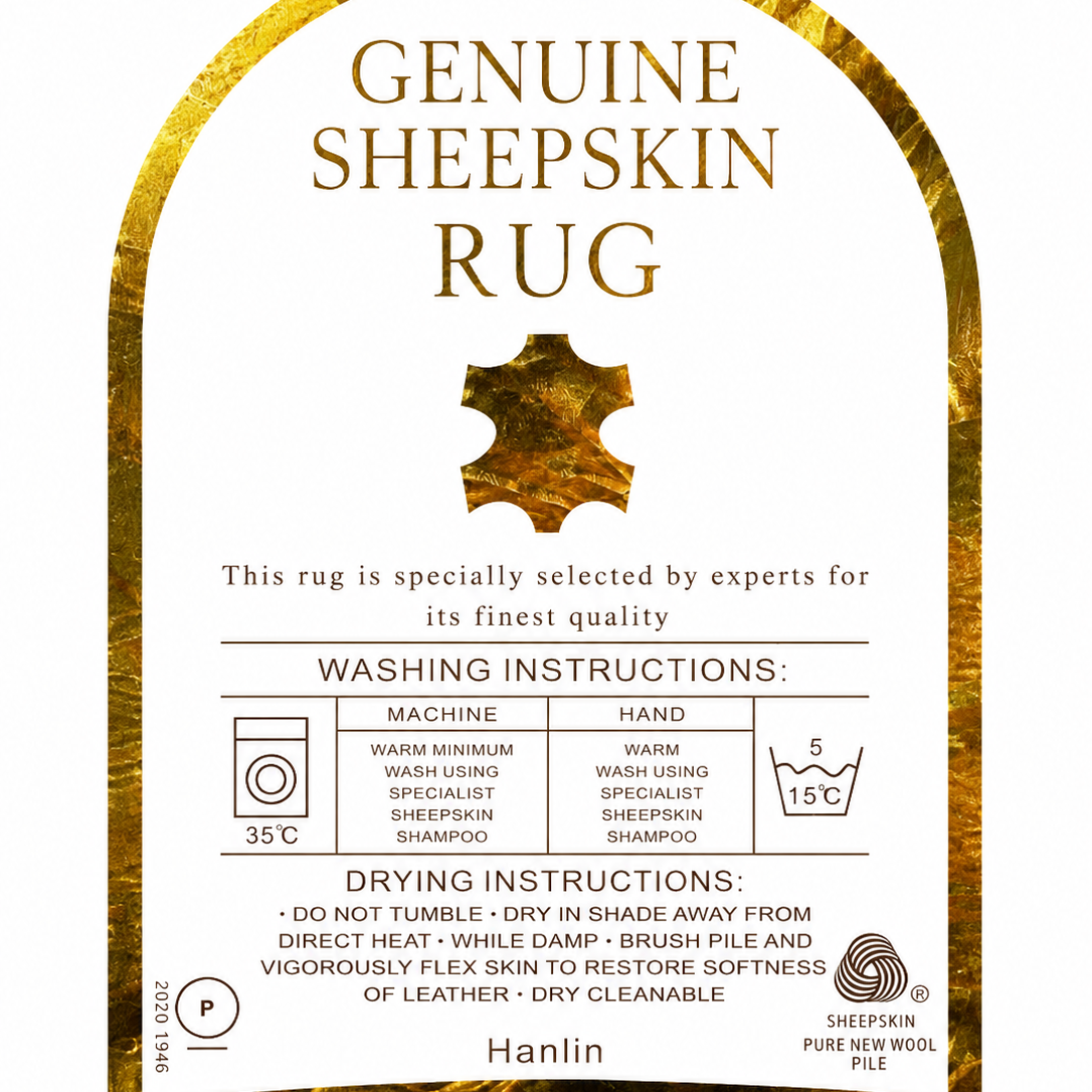 A square product label for a Genuine Sheepskin Rug by Hanlin, featuring a white center with gold text and washing/drying instructions, framed by a textured gold sheepskin border.