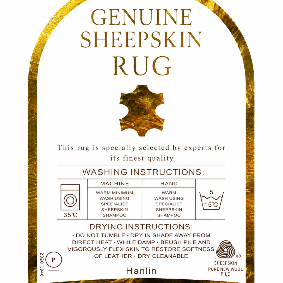 A square product label for a Genuine Sheepskin Rug by Hanlin, featuring a white center with gold text and washing/drying instructions, framed by a textured gold sheepskin border.